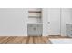 Built-in kitchenette area with custom cabinets and floating wood shelves at 2363 Reepsville Rd, Lincolnton, NC 28092