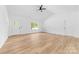Bright, open living area features vaulted ceilings, a ceiling fan and wood-look flooring at 2363 Reepsville Rd, Lincolnton, NC 28092