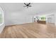 Bright, open living area adjacent to kitchen features vaulted ceilings and wood-look flooring at 2363 Reepsville Rd, Lincolnton, NC 28092