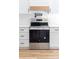 Modern stainless steel oven with white cabinets and light wood flooring at 2363 Reepsville Rd, Lincolnton, NC 28092