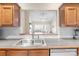 Open concept kitchen featuring a pass-through to the living area, enhancing connectivity and light at 2783 Clover Nw Rd, Concord, NC 28027