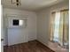 A bedroom showcasing a small fireplace with natural light coming through a window with blinds at 301 Louise St, Lancaster, SC 29720