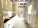 Bathroom with white vanity and tiled shower/tub, awaiting final touches for modern comfort at 318 Stanback St, Mount Gilead, NC 27306