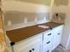 Close-up of a new bathroom vanity with a countertop, new cabinets and unfinished walls at 318 Stanback St, Mount Gilead, NC 27306