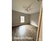 Bedroom features neutral colors, a ceiling fan, wood-look floors, a window, and white trim at 318 Stanback St, Mount Gilead, NC 27306