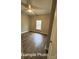 Neutral bedroom with light-colored walls, ceiling fan, wood-look floors, and a bright window at 318 Stanback St, Mount Gilead, NC 27306