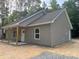 Attractive single-story home with vinyl siding, a covered porch, and white trim at 318 Stanback St, Mount Gilead, NC 27306