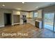 Modern kitchen with stainless steel appliances, white cabinetry, and an adjacent dining area at 318 Stanback St, Mount Gilead, NC 27306