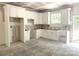 Bright kitchen featuring white cabinets, modern design, and natural light from the window at 318 Stanback St, Mount Gilead, NC 27306