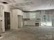 Spacious kitchen with white cabinets, new countertops, and sliding glass door at 318 Stanback St, Mount Gilead, NC 27306