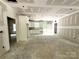Bright kitchen featuring white cabinets, an open layout, and sliding glass doors to outside at 318 Stanback St, Mount Gilead, NC 27306