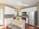 Modern kitchen featuring stainless steel appliances, tile backsplash, and granite counters at 557 S Portman Ln, Fort Mill, SC 29708