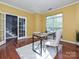 Bright office space with hardwood floors, glass doors, and a large window at 557 S Portman Ln, Fort Mill, SC 29708