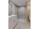 Modern bathroom features a glass-enclosed shower, sleek vanity with marble countertop, and elegant fixtures at 6049 King Charles Ct, Charlotte, NC 28213