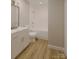 Well-lit bathroom with a combination tub and shower, modern vanity with marble countertop, and stylish fixtures at 6049 King Charles Ct, Charlotte, NC 28213