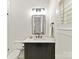 Modern half-bathroom with a sleek vanity, updated fixtures, and a neutral color palette at 911 Abilene Ln, Fort Mill, SC 29715