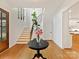 Open foyer featuring hardwood floors, a staircase with iron railings, and natural light at 911 Abilene Ln, Fort Mill, SC 29715