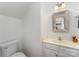 Clean bathroom with white vanity, framed mirror, and a neutral color scheme at 10015 Garrison Watch Ave # 168, Charlotte, NC 28277