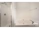 Bright bathroom with a separate tub and shower for a luxurious and relaxing experience at 10015 Garrison Watch Ave # 168, Charlotte, NC 28277