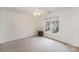 Bedroom with carpeted floors, ceiling fan, and a window overlooking the neighborhood at 10015 Garrison Watch Ave # 168, Charlotte, NC 28277
