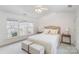 Bright bedroom with a ceiling fan and lots of natural light from the three windows at 10015 Garrison Watch Ave # 168, Charlotte, NC 28277