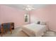 Bedroom with a ceiling fan and a window that provides natural light at 10015 Garrison Watch Ave # 168, Charlotte, NC 28277