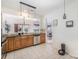 Cozy kitchen featuring wood cabinets, stainless steel appliances, and an open layout at 10015 Garrison Watch Ave # 168, Charlotte, NC 28277