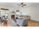 Bright living room features a cozy fireplace, hardwood floors, and neutral decor at 10015 Garrison Watch Ave # 168, Charlotte, NC 28277