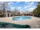 Community pool area with a clean and inviting pool with neighborhood buildings surrounding it at 10015 Garrison Watch Ave # 168, Charlotte, NC 28277