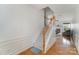 Inviting staircase with hardwood floors and white wood trim leads to the upper level at 10015 Garrison Watch Ave # 168, Charlotte, NC 28277
