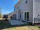 Exterior view of the backyard featuring a patio, vinyl siding, and a sliding door leading to the interior at 121 Pine Eagle Dr, Rock Hill, SC 29732