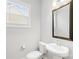 Well-lit bathroom featuring a pedestal sink, modern fixtures and a window at 121 Pine Eagle Dr, Rock Hill, SC 29732