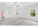 Spacious, well lit bedroom with plush carpet, ceiling fan, and large windows with green views at 121 Pine Eagle Dr, Rock Hill, SC 29732