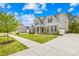 Well-maintained two-story home boasting a large driveway and a lush, green lawn at 121 Pine Eagle Dr, Rock Hill, SC 29732