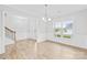 Bright and airy living room with wood floors, large windows, and elegant trim at 121 Pine Eagle Dr, Rock Hill, SC 29732