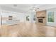 Open floor plan with a stone fireplace, white kitchen cabinets and a large island at 121 Pine Eagle Dr, Rock Hill, SC 29732
