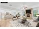 Open concept living room and kitchen area with stone fireplace and breakfast bar seating at 121 Pine Eagle Dr, Rock Hill, SC 29732