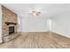 Spacious living room featuring a stone fireplace, ceiling fan, and wood-look flooring at 121 Pine Eagle Dr, Rock Hill, SC 29732