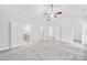 Open bedroom with multiple doors, light gray carpet, neutral walls and ceiling fan at 121 Pine Eagle Dr, Rock Hill, SC 29732