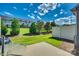 Green backyard with well-kept lawn, trees, and a patio for outdoor enjoyment at 1213 Bhaltair Ln, Fort Mill, SC 29708