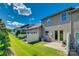 Townhome backyard with green grass, patio, privacy fence, and grill at 1213 Bhaltair Ln, Fort Mill, SC 29708