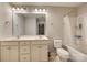 Clean, bright bathroom with double vanity, toilet, and shower-tub combination at 1213 Bhaltair Ln, Fort Mill, SC 29708