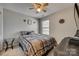 Comfortable bedroom with ceiling fan and natural light from the bright window at 1213 Bhaltair Ln, Fort Mill, SC 29708