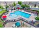 A pool featuring a splash pad and lounge chairs surrounded by homes in the community at 1213 Bhaltair Ln, Fort Mill, SC 29708