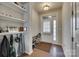 Bright foyer with shelves, coat hooks, and tiled entryway leading to the main living area at 1213 Bhaltair Ln, Fort Mill, SC 29708