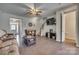 Open living area featuring hardwood floors, neutral paint colors and access to stairs at 1213 Bhaltair Ln, Fort Mill, SC 29708