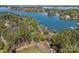 Stunning aerial view of a waterfront property on a large lake surrounded by lush trees and serene landscapes at 126 Balmoral Dr, Mooresville, NC 28117