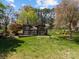 Charming home with a rustic exterior, surrounded by lush greenery and a spacious lawn at 126 Balmoral Dr, Mooresville, NC 28117