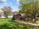 Beautiful waterfront property with lush lawn, mature trees, and private dock at 126 Balmoral Dr, Mooresville, NC 28117