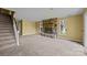 Cozy living room featuring a stone fireplace and staircase at 126 Balmoral Dr, Mooresville, NC 28117